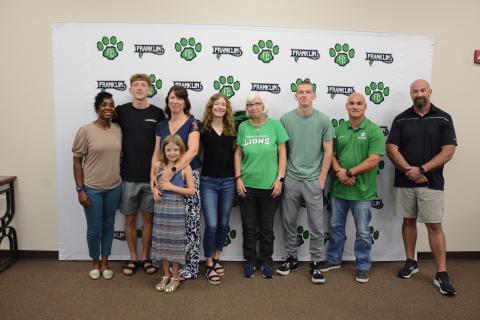 Attending the Franklin County Board of Education meeting Thursday for the naming and dedication of the system’s cross-country course as the Bill “Woody” Woods Pridelands Course are (from left) FCHS Track Coach Ann Bowman, Cole Woods, Heather Woods, Lelia Woods, Gracie Woods, Donna Barnes, Robbie Woods, Jared Hightower and FCHS Cross-Country Coach Clint Tanner. (Photo by Charlie Eavenson)