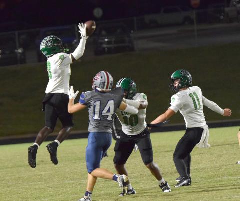 Jeremiah Mayfield leaps for an interception that he would return 65 yards for a touchdown against West-Oak Friday in Westminster, S.C. (Photos by Shane Scoggins)