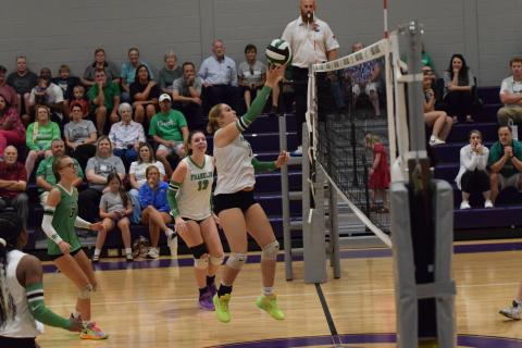 Callie Frady pokes the ball over the net in action against East Hall Thursday at South Franklin Elementary School. (Photos by Shane Scoggins)