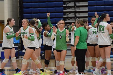 Enslee Stowers (No. 3) and Callie Frady (No. 7) lead the Lady Lions out of a timeout during Saturday’s state semifinal match against Ringgold in Marietta.