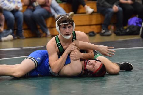 Lion Jacob Henkel works to pin a Banks County opponent during action Tuesday at the wrestling gym in Carnesville. (Photo by Shane Scoggins)