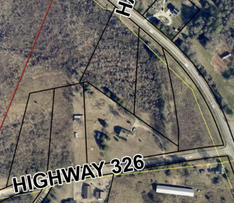 Commissioners approved an appeal of the denial of building permits for four parcels of property on Highway 326 and Sandy Cross Road after a lengthy debate last week.