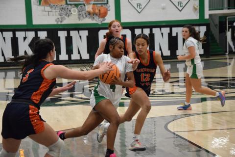 Lady Lion Nykhia Johnson drives toward the basket in action last week against Habersham Central in the Lion’s Den. Johnson finished with eight points. (Photo by Shane Scoggins)