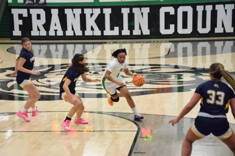 Ta’Kiaha Winkfield drives past a Prince Avenue defender in Friday’s Franklin County win over the Lady Wolverines. The game was Winkfield’s season debut after missing the start of the season due to injury. (Photos by Shane Scoggins)