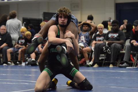 Jaxon Norwood works to finish a takedown against an Appling County opponent Friday in the State Duals Championship at East Jackson High School. (Photo by Shane Scoggins)