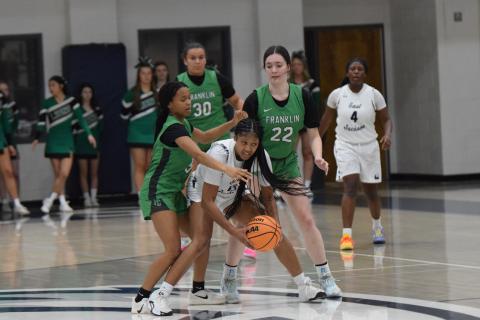 Zy Merritt (left) and Avery Burton (right) surround an East Jackson ball handler during the Franklin County Lady Lions’ win Thursday in Commerce. (Photos by Shane Scoggins)
