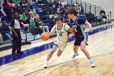 Bentley Huff drives past a Prince Avenue defender in Franklin County's Region 8AA semifinal win Wednesday night in Bogart.