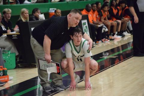 Franklin County Lion Coach Jason Shaver talks with senior Bentley Huff during a break in play during Friday’s win over Hart County in the Lions Den. (Photo by Shane Scoggins)