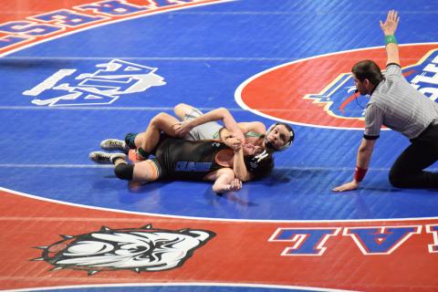 Franklin County Lion Josh Baughcum wraps up an opponent during his run to the Class AA 150-pound state championship. (Photo by Shane Scoggins)