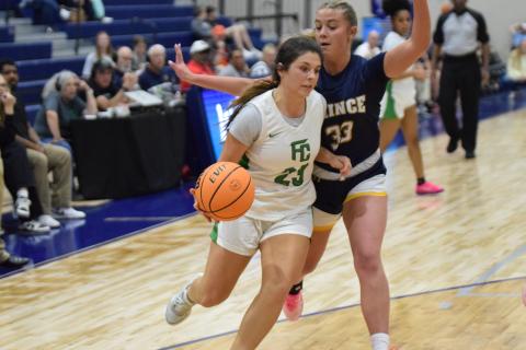 Bella Rosene drives to the basket against Prince Avenue in the Region 8AA consolation game Friday in Bogart. Rosene made the game-winning basket Tuesday to send the Lady Lions to the second round of the state playoffs. (Photo by Shane Scoggins)
