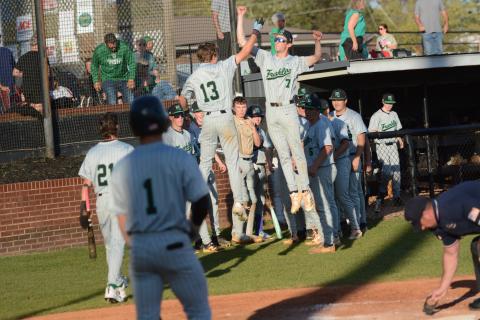 Gavin Holman (No. 13) and Eli Moore (No. 7) celebrate after Holman’s home run against Hart County Monday in Hartwell. (Photo courtesy of Benjamin London of The Hartwell Sun)