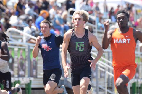 Carson Cheek competes in the 100 meter dash at Saturday's John Scott Hartness Invitational at FCHS. The Lions won first place in the meet over a field of 13 other competitors.