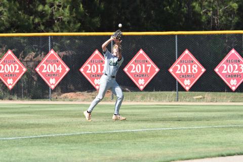 Gavin Holman makes a catch in rightfield during a state semifinal game at Morgan County Thursday. (Photo by Shane Scoggins)