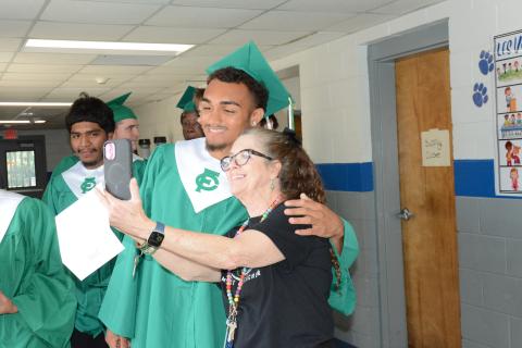 Franklin County High School senior Nava Ware (left) takes a selfie with Lavonia Elementary School teacher Cathy Cavin during the Class of 2026’s Graduation Walk Thursday. The seniors are invited to take part in a Graduation Parade around the county Sunday. FCHS graduation is scheduled for May 22. (Photo by Charlie Eavenson)