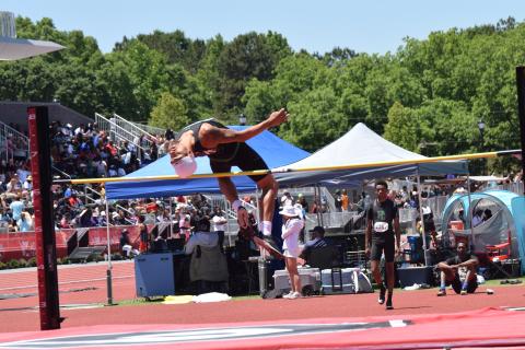 Nava Ware clears the bar in the high jump at the state meet. (Photo by Shane Scoggins)