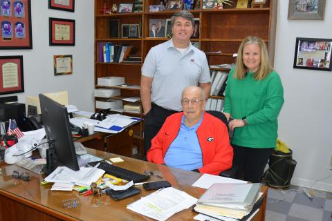 The staff of Beasley Tax and Financial Service, which is celebrating 50 years in business in 2026, includes Tommy Beasley (seated), Rusty Beasley (standing left) and Kelley Schulman. (Photo by Charlie Eavenson)