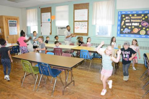 Learning is fun at the educational summer program being held at the Boyd Outz Learning Center. Students from kindergarten to second grade are working on sight words, math and problem-solving skills under the leadership of Kevin Norris and Karla Kidd. (Photo by Charlie Eavenson)