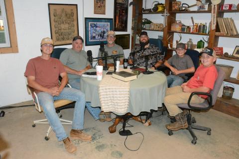 Colt Hart of Sandy Cross says his goal with the Dirt Road Disciples podcast is to share the Gospel of Jesus Christ. The podcast group includes (from left)  Parker Hobson, Billy Dial, Jeremy Sharpton, Hart and Hart’s sons Sage and Briar. Not pictured are Jacob Pittman and Tim Smith. (Photo by Charlie Eavenson)