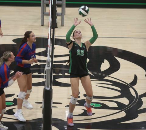 Avery Burton sets the ball Tuesday in action against Jefferson. (Photos by Rose Scoggins)