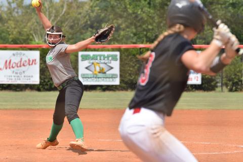 Anna Lunsford delivers a pitch to a Harlem hitter during a game Saturday at Madison County High School in Danielsville. (Photos by Shane Scoggins)