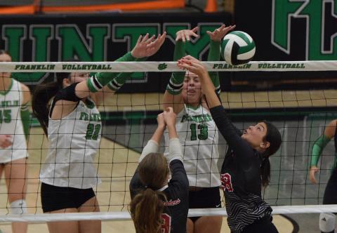 Lady Lions Avery Burton (left) and Sydney Carson (right) stuff a Madison County shot Thursday in non-region action in The Lion’s Den. (Photos by Shane Scoggins)