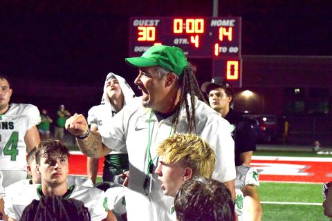 Coach Chuck Holland tells his team how proud he is of them after the Franklin County Lions defeated Madison County 30-14 Friday in Danielsville. (Photos by Shane Scoggins)