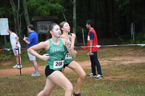 Franklin County Lady Lions Savannah Jackson and Reese Smith race each other to the finish line Saturday at the North Oconee Titans Invitational in Bogart. (Photo by Shane Scoggins)