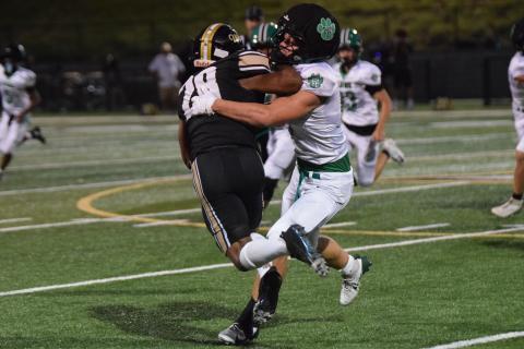 Elliott Harbin latches on to an East Hall ballcarrier for one of the Lion’s 23 tackles in Friday’s game, which set a new single game school record for tackles.