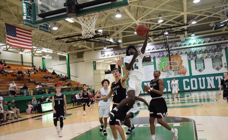 Micah Roebuck takes an acrobatic shot earlier this season against Jackson County.