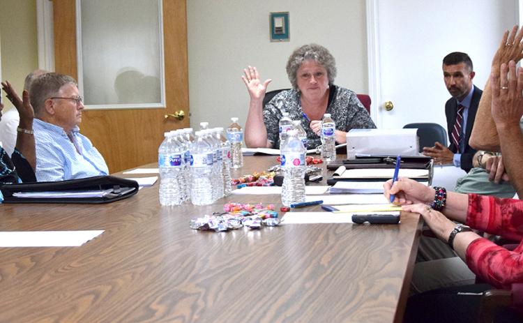 Members of the Franklin County Ethics Board – Joann Butler, Jackie Payne, Chairman Debra Grizzle, Michael O’Connell and Mark Herndon – vote Monday to dismiss a complaint filed by Daniele Weaver against county officials. (Photo by Scoggins)