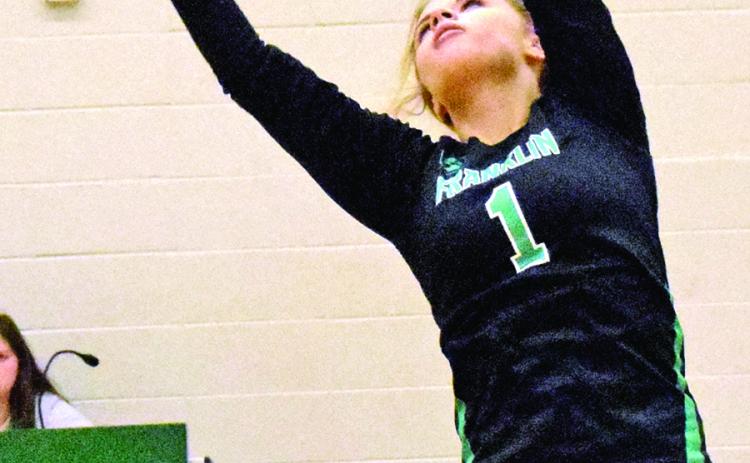Maci McFarlin sets a ball during action Tuesday against Monroe Area at Rocky Ford Park Gym in Carnesville. (Photo by Scoggins)