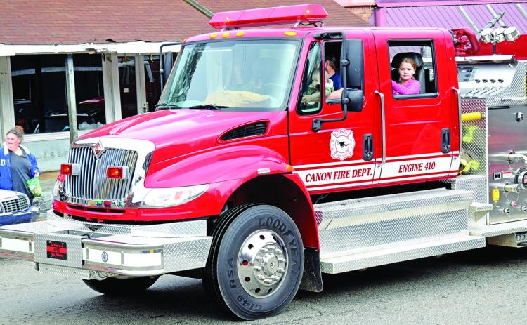 Good equipment (like this engine riding in the Canon Christmas Parade) and training of "a great group of guys" is credited with an improvement in Canon’s ISO rating from a 6 to a 2.