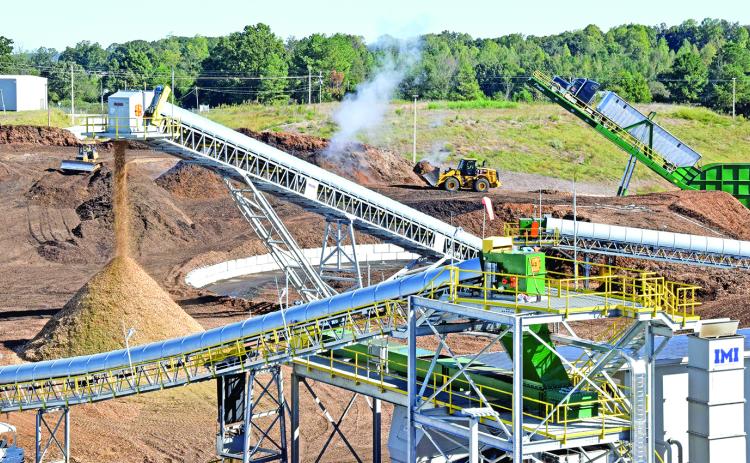 A large pile of wood will be burned to create electricity at the GRP Franklin plant, county officials learned on a tour Monday. Water runoff from the wood pile was the source of recent pollution in Indian Creek.
