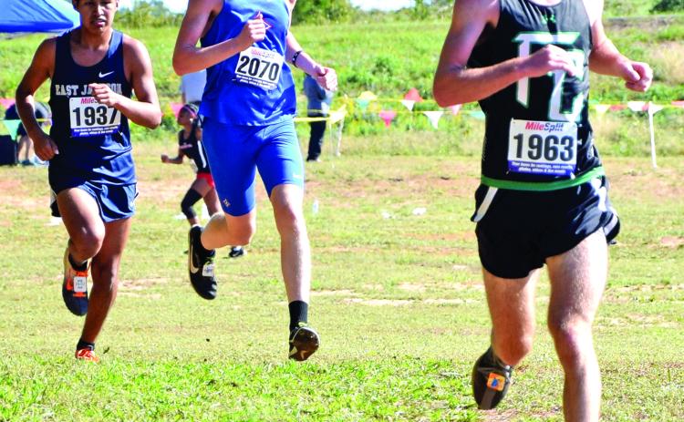Lion Keaton Burton (right) took fourth-place overall to lead the Franklin County boys’ cross country team to the state meet for the first time in at least 12 years. (Photos by Scoggins)