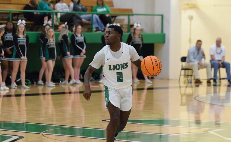 Lion Qua Jones looks for a play against Oglethorpe County Saturday in the Lions Den.