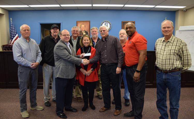 The city of Royston received a donation Thursday from Steve and Robin Williams. Pictured at the presentation of the $50,000 check are (front, from left) Royston Mayor David Jordan, Robin Williams, Steve Williams, Council members Keith Turman and Wayne Braswell, (back) City Manager Ed Andrews, Council members Matt Fields, Larry Bowen, Lee Strickland and Kenneth Roach. The money will be used to continue planning and construction of an amphitheater at the Royston Wellness and Community Park. (Photos by