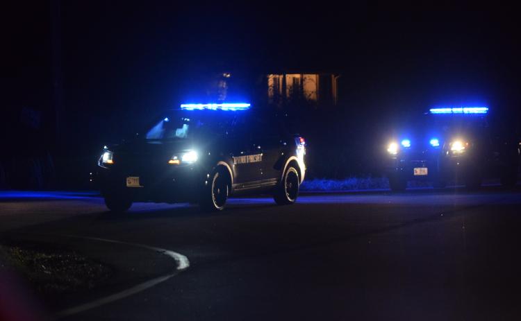 Law enforcement officers blocked off High Road in Carnesville Tuesday after a man threatened to blow up his home. The man was later injured when he did set off an explosion.