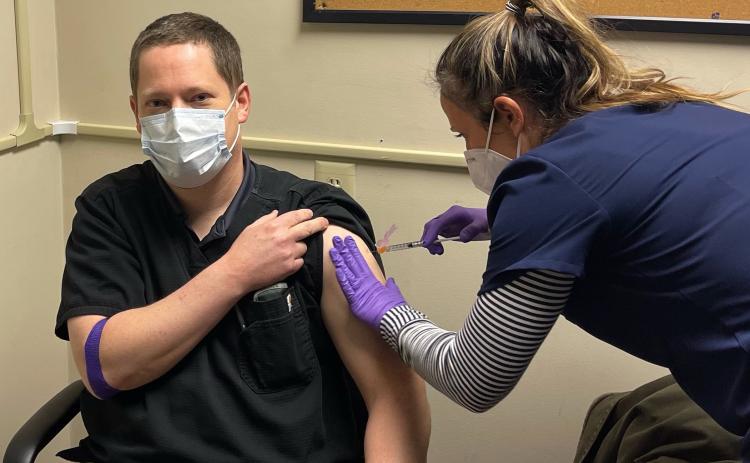 Jason Macomson gets vaccinated for the COVID-19 virus by a nurse at VitaLink Research in Anderson, S.C. Macomson and five other Franklin County residents took part in trials for the new Moderna coronavirus vaccine.