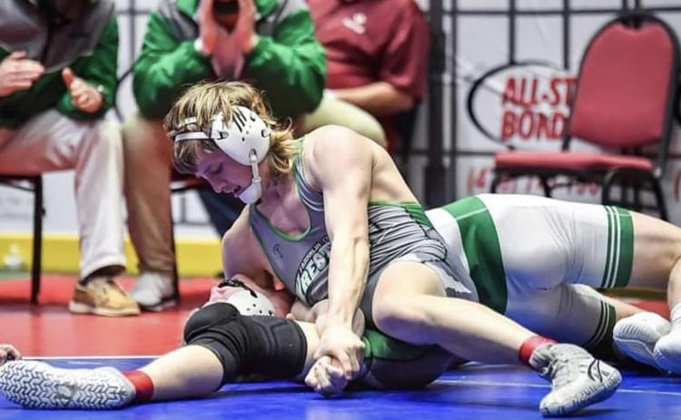 Franklin County Lion Charlie Henkel pins his opponent to win the Class AAA 170-pound championship last week at the state tournament in Macon. (Photo courtesy of Amber Cloy Photography)