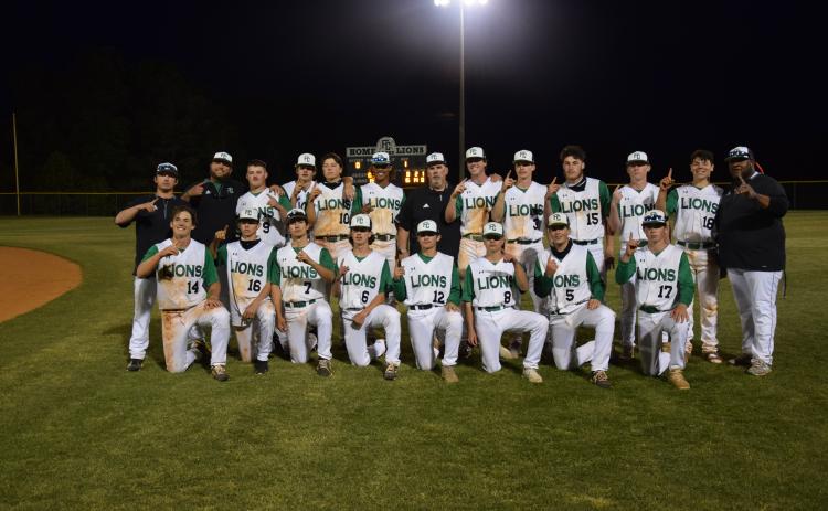 The Franklin County Lions celebrated their Region 8AAA baseball championship Friday night at FCHS after sweeping East Jackson in a doubleheader. Team members are (front, from left) Kayne Jinks, Ryder Emmons, Dee Oliver, Bryson Halbrook, Payton Crump, Will Cary, Duncan Beasley, Rylan Tamplin, (back) Coach Elliott Beard, Coach Ryan Phillips, J.D. Ginn, Garrett Garner, Lawson Gailey, C.J. Blackwell, Head Coach David Skelly, Chandler Coulter, Evan Herring, Landon Bruce, Miles Dodd, A.J. Peeples and Coach Demond