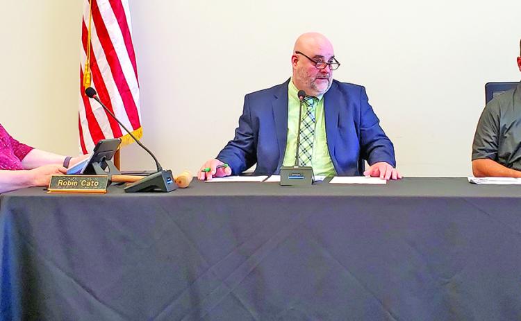 In Superintendent Chris Forrer’s absence, Chuck Colquitt is filling his role as acting superintendent, including filling his seat between Robin Cato and Alan Mitchell at Franklin County Board of Education meetings. (Photo by Sinclair)