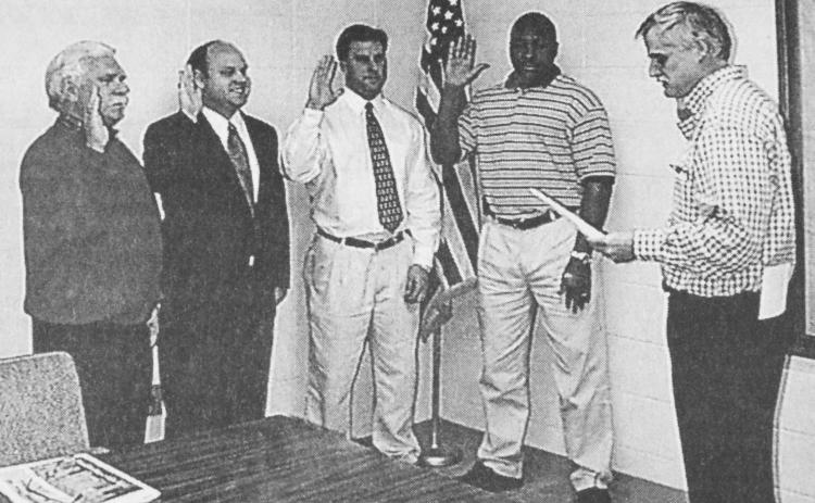 In this photo, first published in the Jan. 6, 2000, issue of The News Leader, David Jordan (second from left) and Keith Turman (second from right) are sworn in as new members of the Royston City Council by then-Mayor Steve Williams (right), along with Paul Crawford (left) and Greg Gurley (center). Turman was the only person to qualify to run for mayor of Royston in November. Current Mayor Jordan decided not to run.