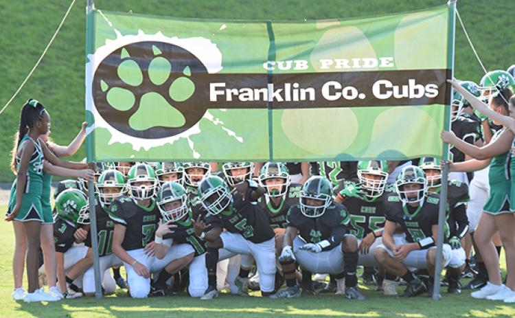 The Franklin County MIddle School Cubs, preparing to run onto the field before a recent game, clinched a region playoff berth with a 26-7 win over Habersham County last week. (Photos by Scoggins)