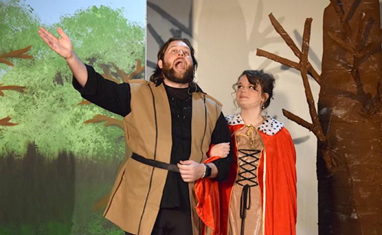 King Arthur (Josh Bryan) shares the magic of Camelot with Guenevere (Jamee Floyd) in the title number. (Photo by Sinclair)