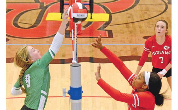 Lady Lion Teague Pierce pokes the ball back over the net in volleyball action against Stephens County last week in the Region 8AAA tournament. (Photo by Scoggins)