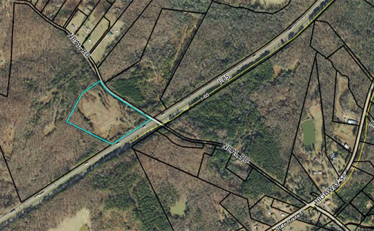 Troy Construction applied to have 15.44 acres at 633 Neal Road rezoned from agriculture intensive to light industrial in order to use the property as storage for the company’s equipment and storage. The property sits along the interstate, but is only accessed by Neal Road.