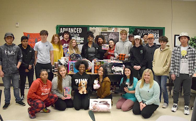 Students in Mandy Ginn’s advanced algebra classes raised $1,400 to purchase gifts for three local families and supplies for families in Kentucky. (Photo by Sinclair)