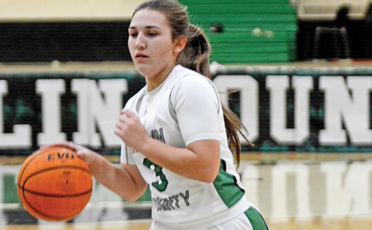 Kayleigh Chappell brings the ball upcourt during action Friday against Dawson County in the Lion’s Den. (Photo by Scoggins)