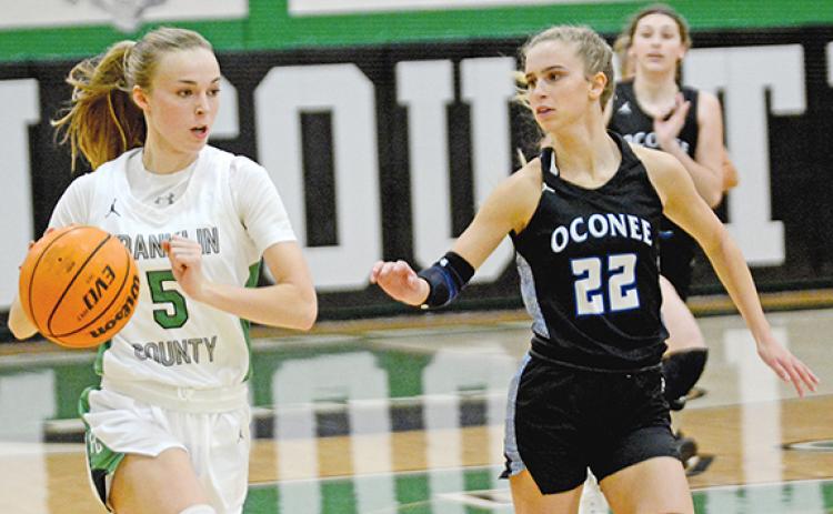 Bailey Aderholdt looks to drive against Oconee County opponents in a game last week in Carnesville. (Photo by Scoggins)