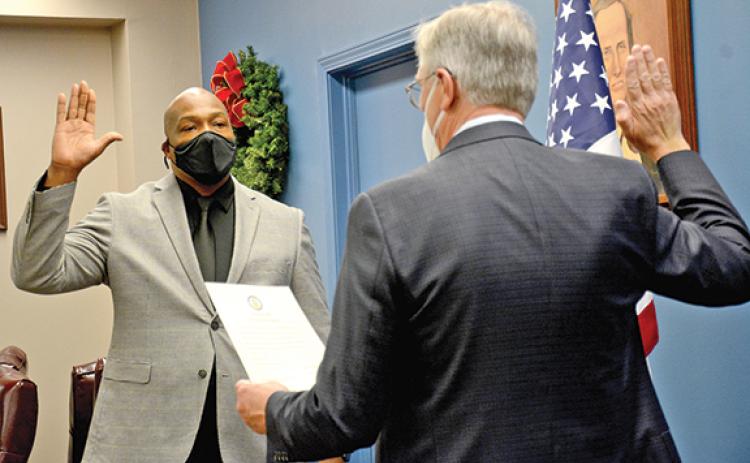 Keith Turman is sworn in as the new mayor of Royston by Superior Court Judge Jeffrey Malcom during a ceremony Thursday at Royston City Hall. (Photo by Scoggins)